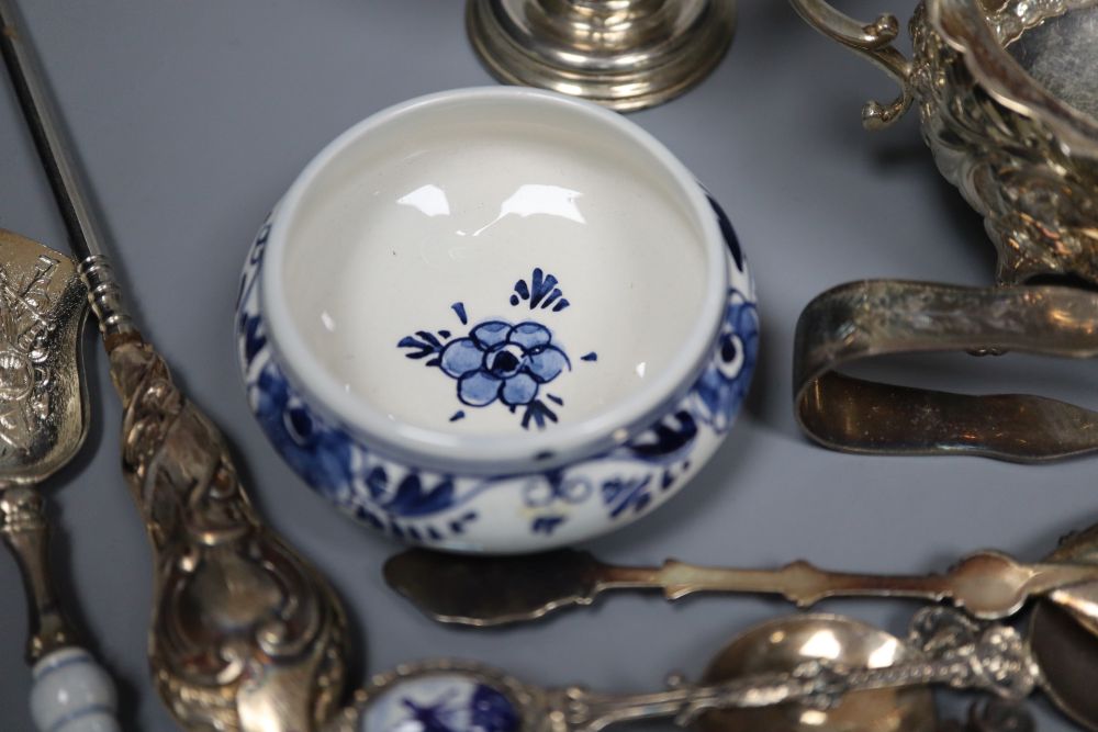 A silver sugar bowl and cream jug, a pair of nut dishes and sundry small silver